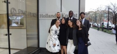 Group of people outside a glass door