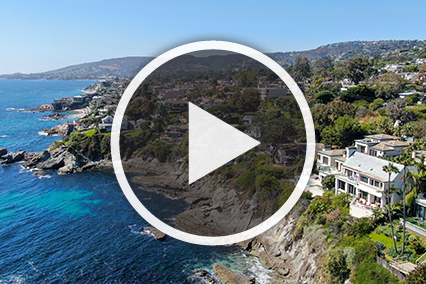 Seaside Mountain with house and play button overlay