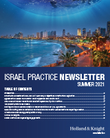 Town by sea coast at night