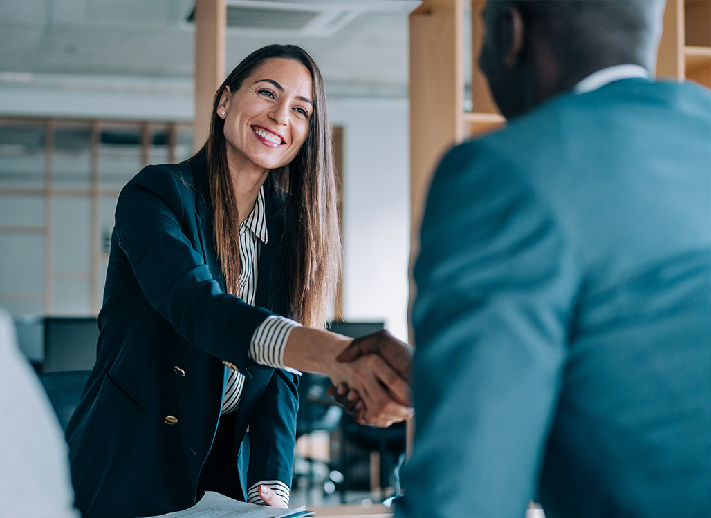 Businesswoman shaking someone's hand