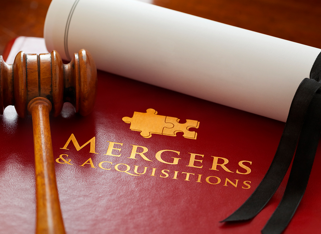 Gavel on red book with gold puzzle pieces