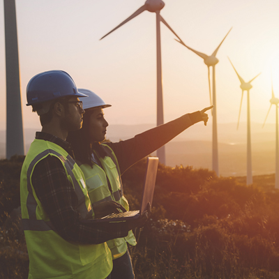 Windmills and construction workers